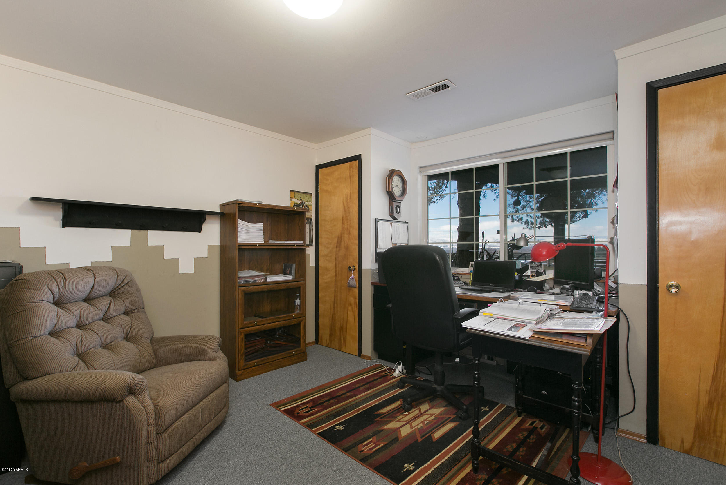 7503 Bittner Road Yakima, WA 98901 - Photo 19 of 31 a living room with furniture fireplace and flat screen tv