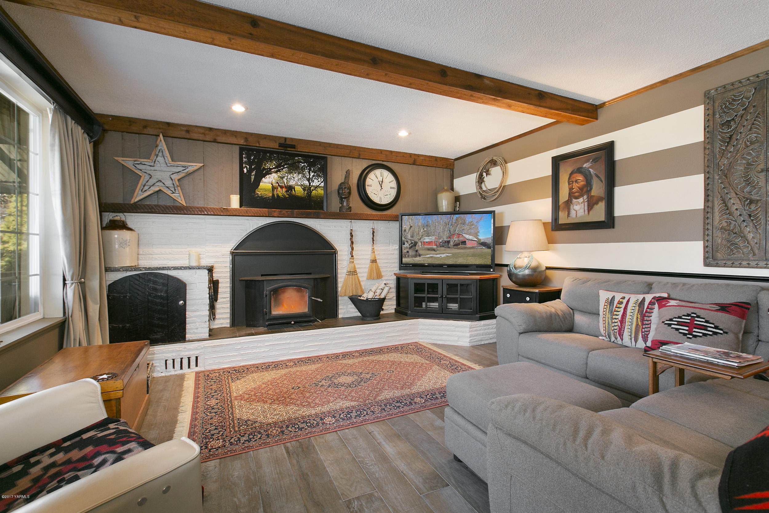 7503 Bittner Road Yakima, WA 98901 - Photo 7 of 31 a living room with furniture and a fireplace