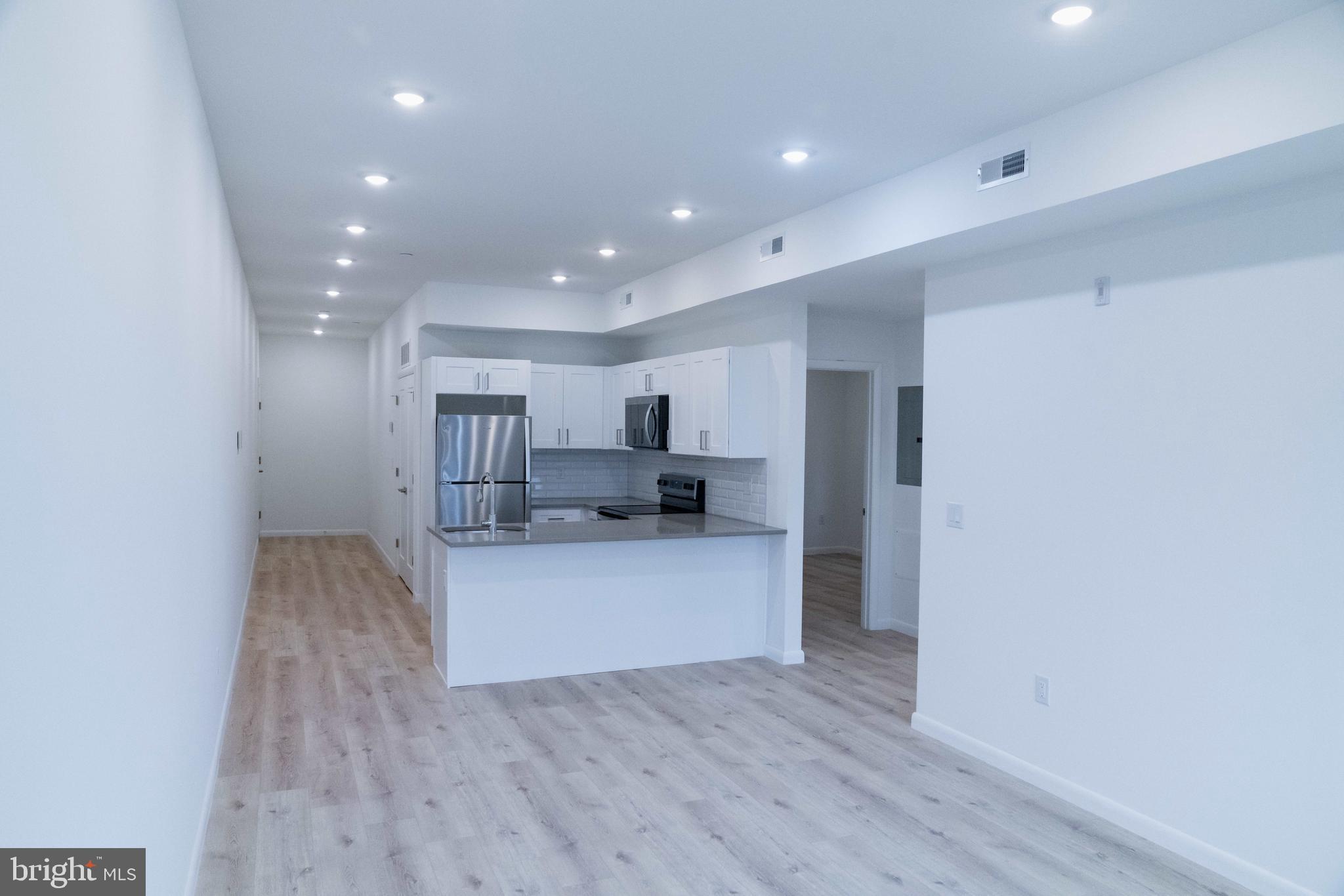 7248 Rising Sun Avenue Philadelphia, PA 19111 - Photo 16 of 36 a view of kitchen with wooden floor