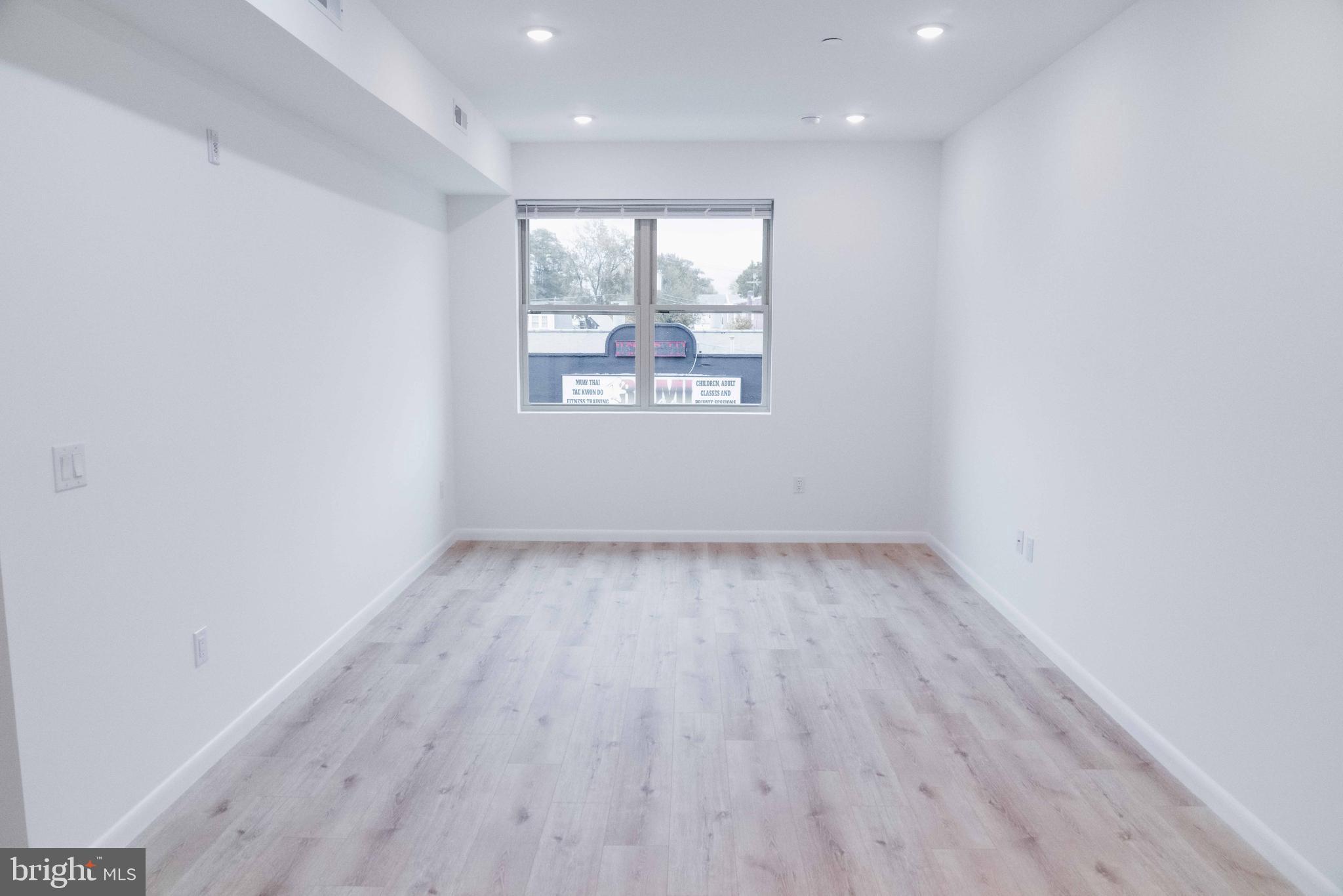 7248 Rising Sun Avenue Philadelphia, PA 19111 - Photo 18 of 36 a view of a room has wooden floor and window