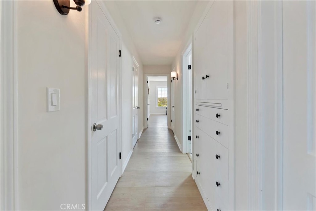 1748 Prince Albert Drive Riverside, CA 92507 - Photo 21 of 42 a view of a hallway with wooden floor