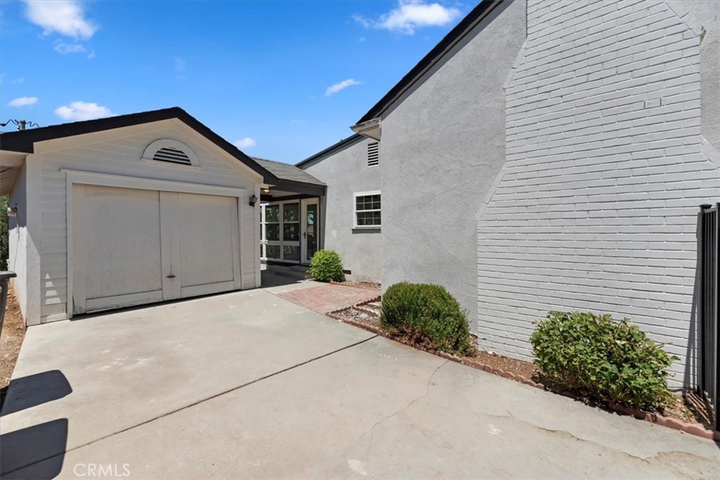 1748 Prince Albert Drive Riverside, CA 92507 - Photo 34 of 42 a front view of a house with a garage