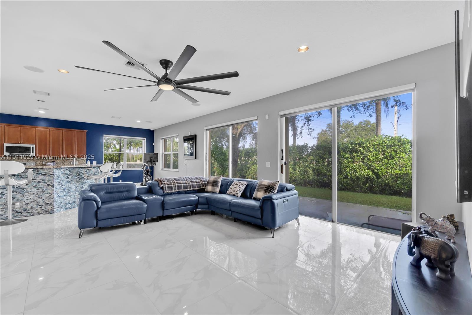 15841 Southwest 61st Street, Unit 15841 Davie, FL 33331 - Photo 13 of 49 a living room with furniture and a large window
