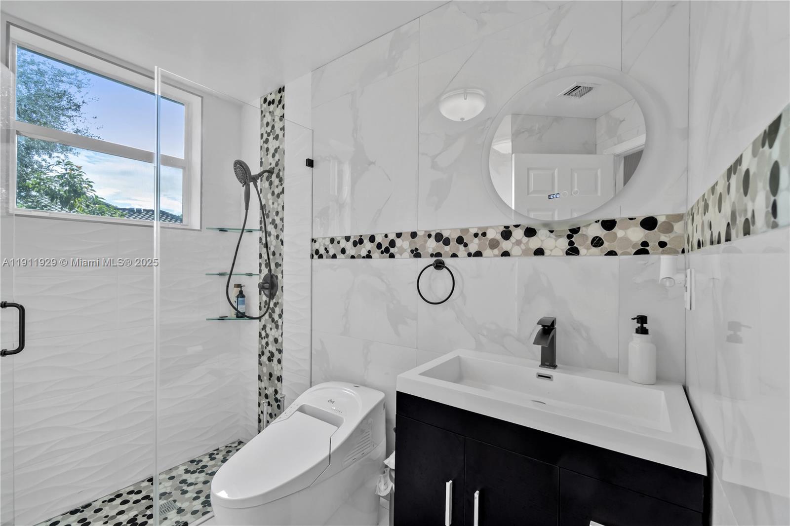 15841 Southwest 61st Street, Unit 15841 Davie, FL 33331 - Photo 19 of 49 a bathroom with a sink a toilet and shower