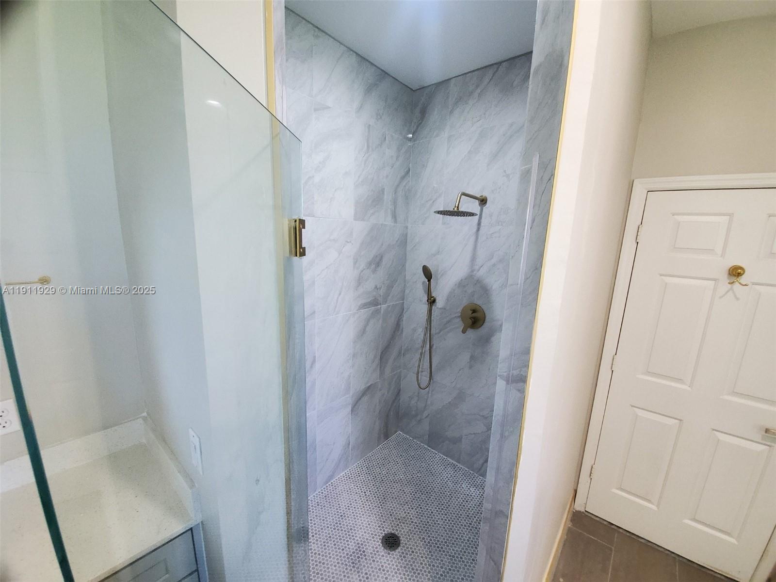 15841 Southwest 61st Street, Unit 15841 Davie, FL 33331 - Photo 25 of 49 a bathroom with a shower