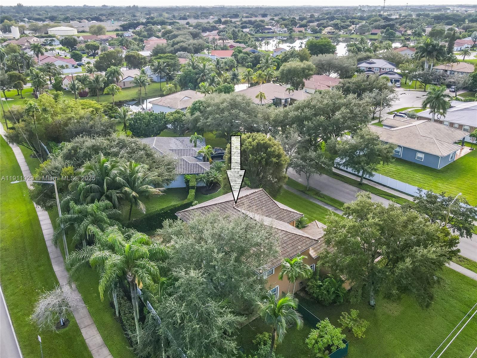 15841 Southwest 61st Street, Unit 15841 Davie, FL 33331 - Photo 38 of 49 an aerial view of residential houses with outdoor space and trees