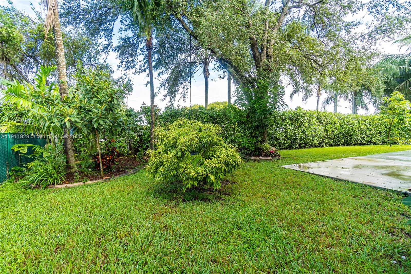 15841 Southwest 61st Street, Unit 15841 Davie, FL 33331 - Photo 45 of 49 a view of a garden with trees