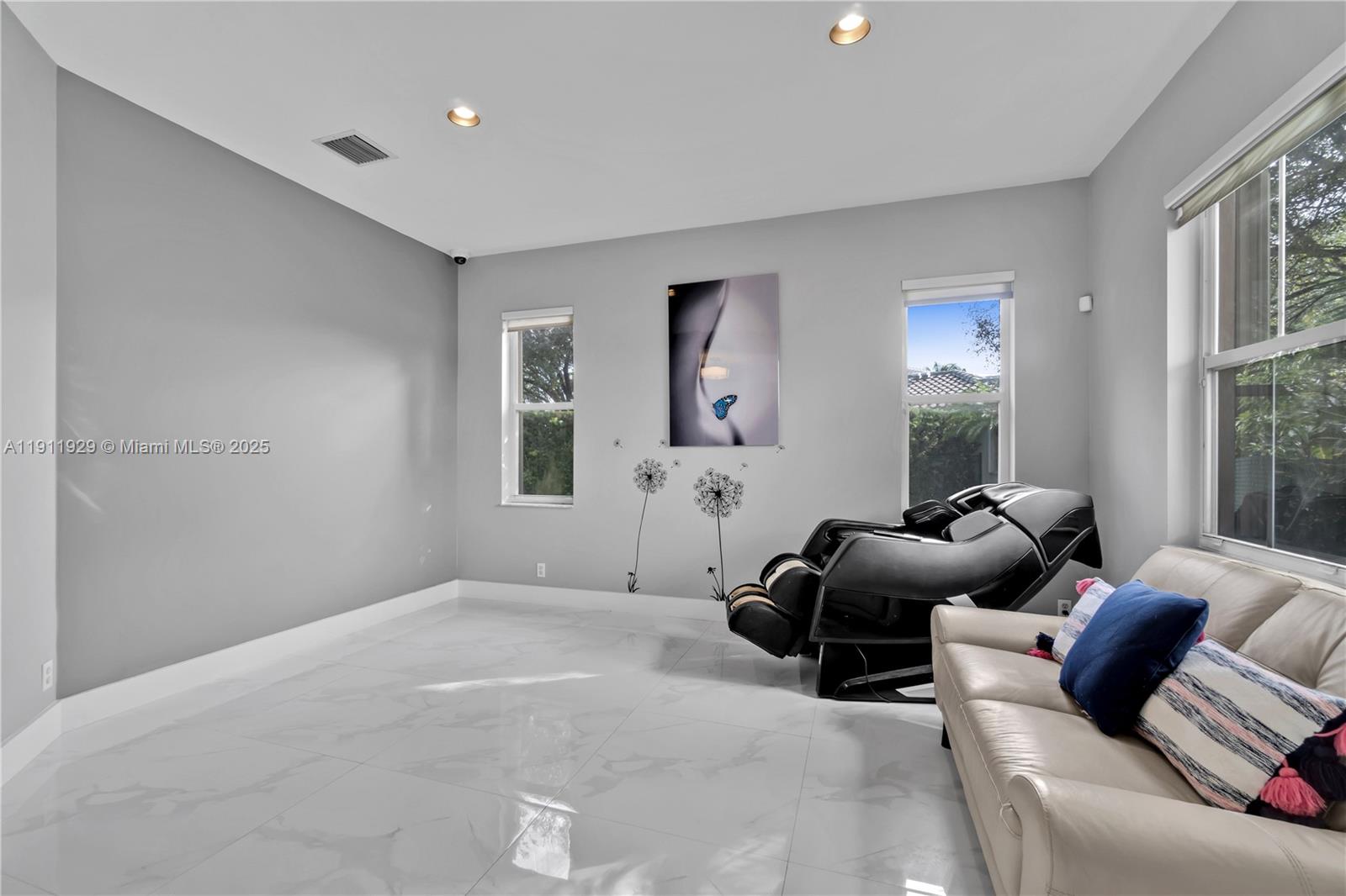 15841 Southwest 61st Street, Unit 15841 Davie, FL 33331 - Photo 6 of 49 a bedroom with furniture and windows