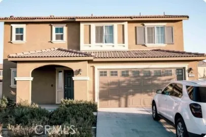 a front view of a house with parking space