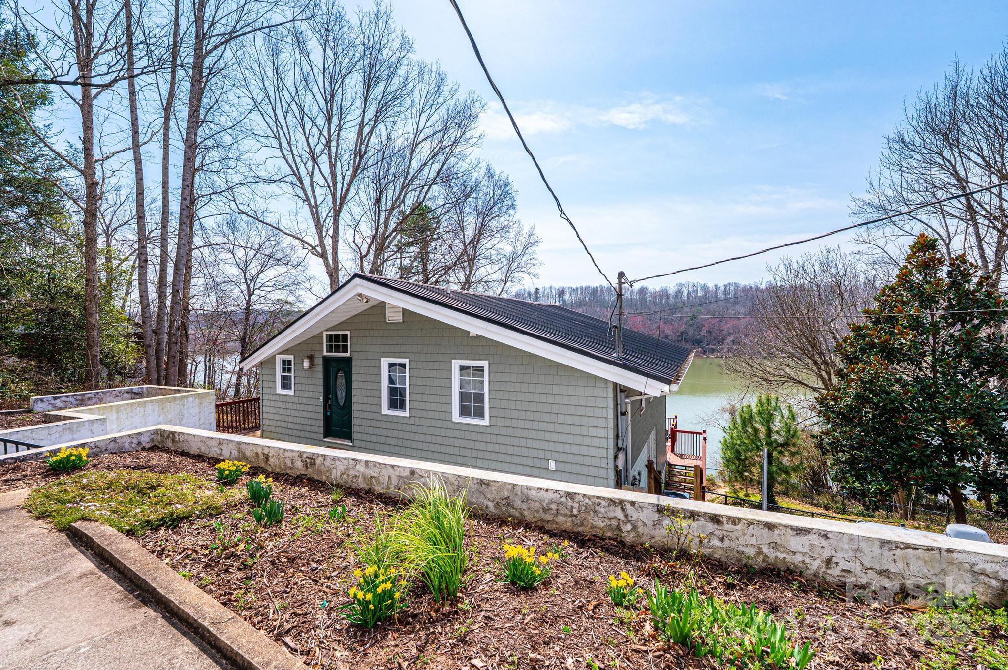 4846 Midway Sand Road Hickory, NC 28601 - Photo 1 of 48 a front view of a house with garden