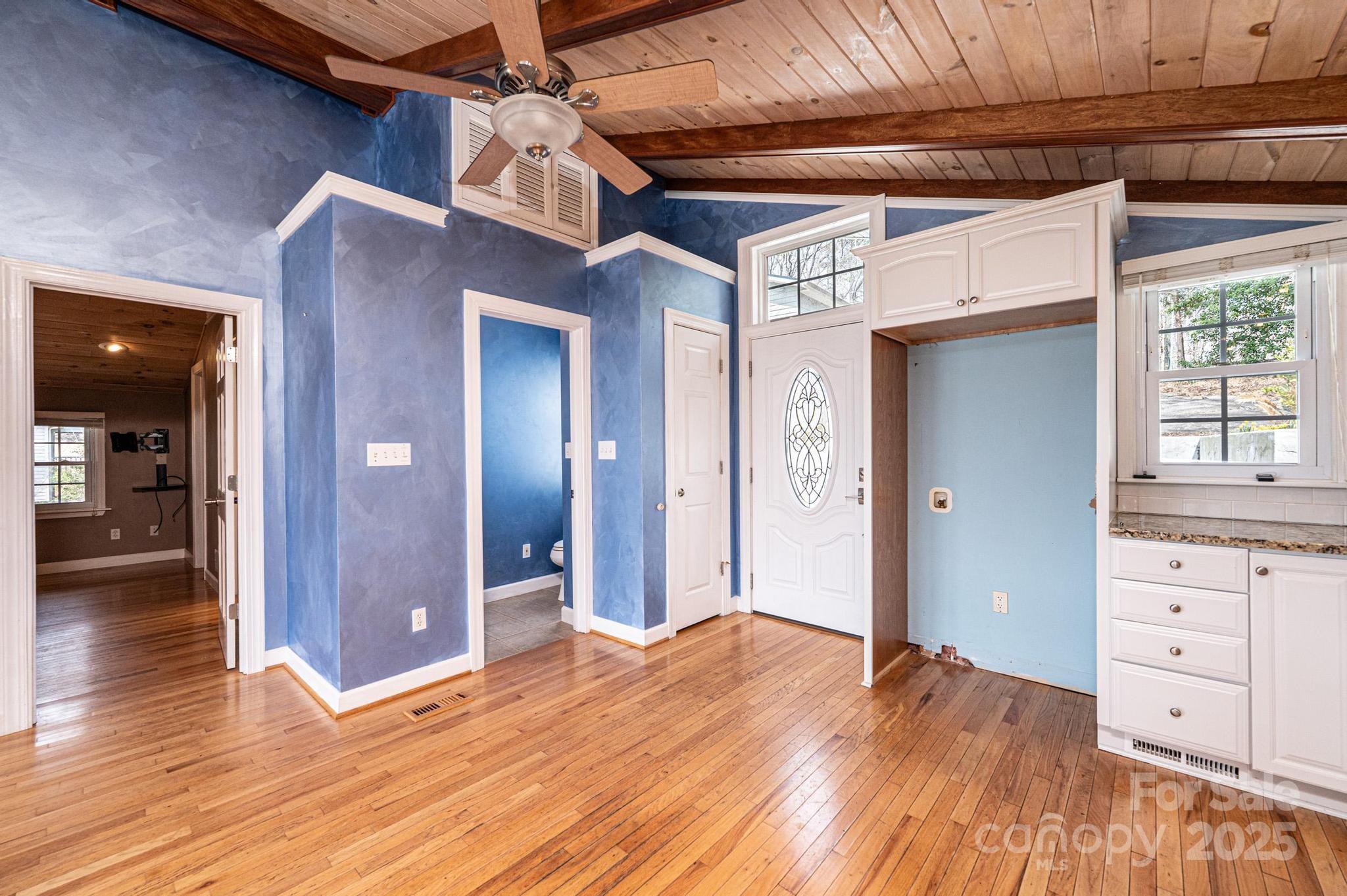 4846 Midway Sand Road Hickory, NC 28601 - Photo 11 of 48 a view of a hallway with wooden floor and cabinet