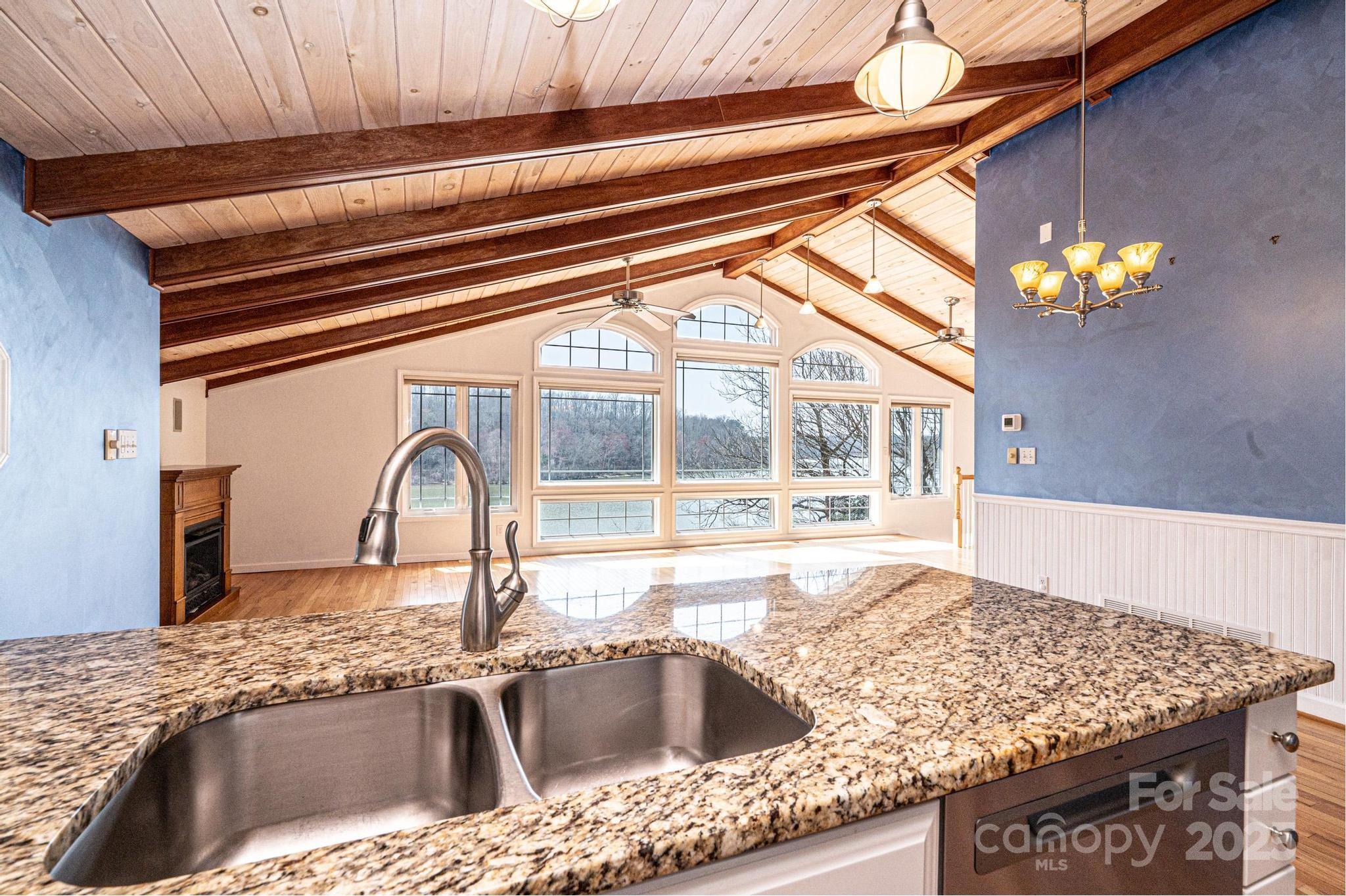4846 Midway Sand Road Hickory, NC 28601 - Photo 12 of 48 a kitchen with a granite countertop sink and natural light