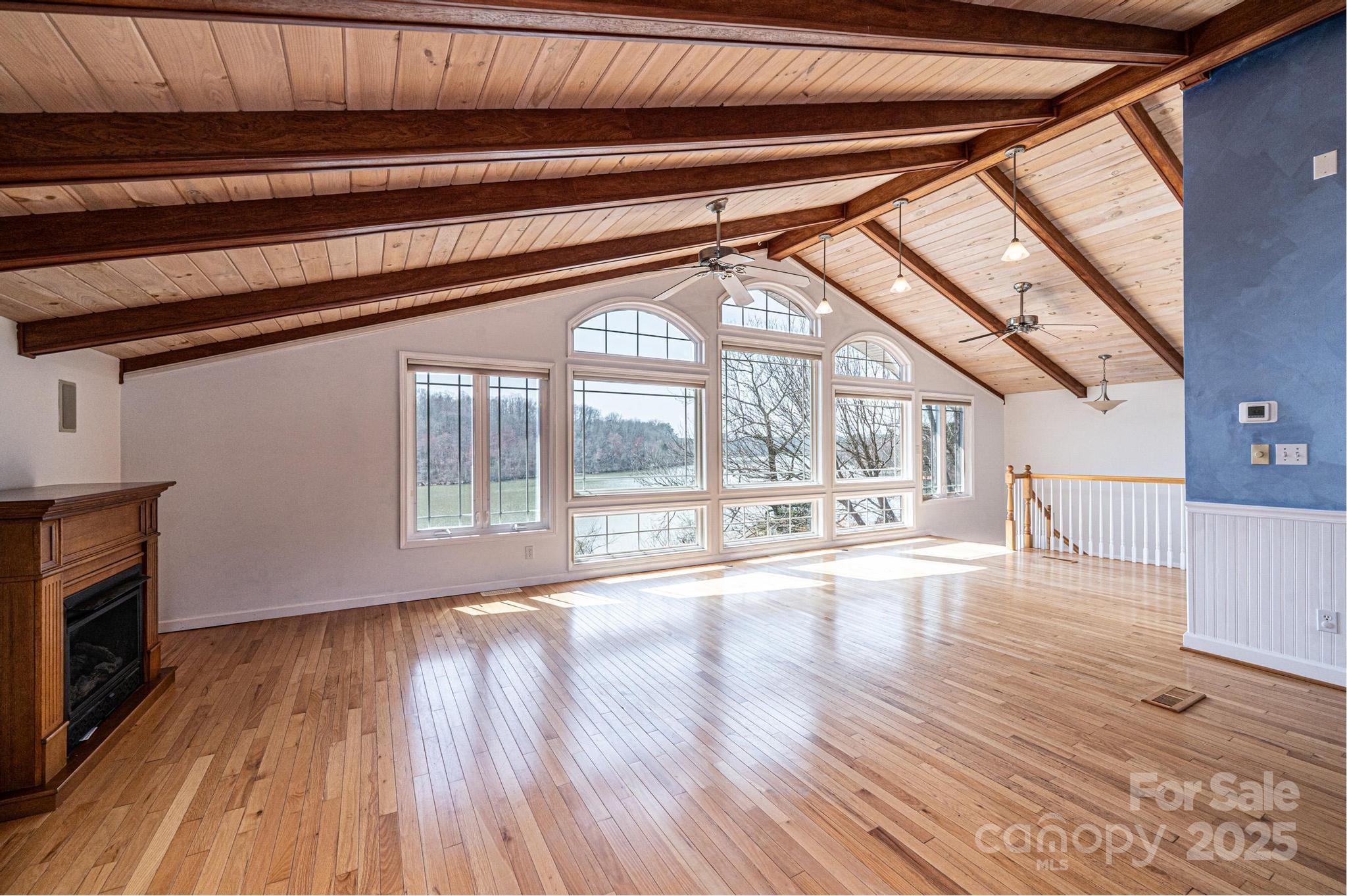 4846 Midway Sand Road Hickory, NC 28601 - Photo 16 of 48 a view of an empty room with wooden floor and a window