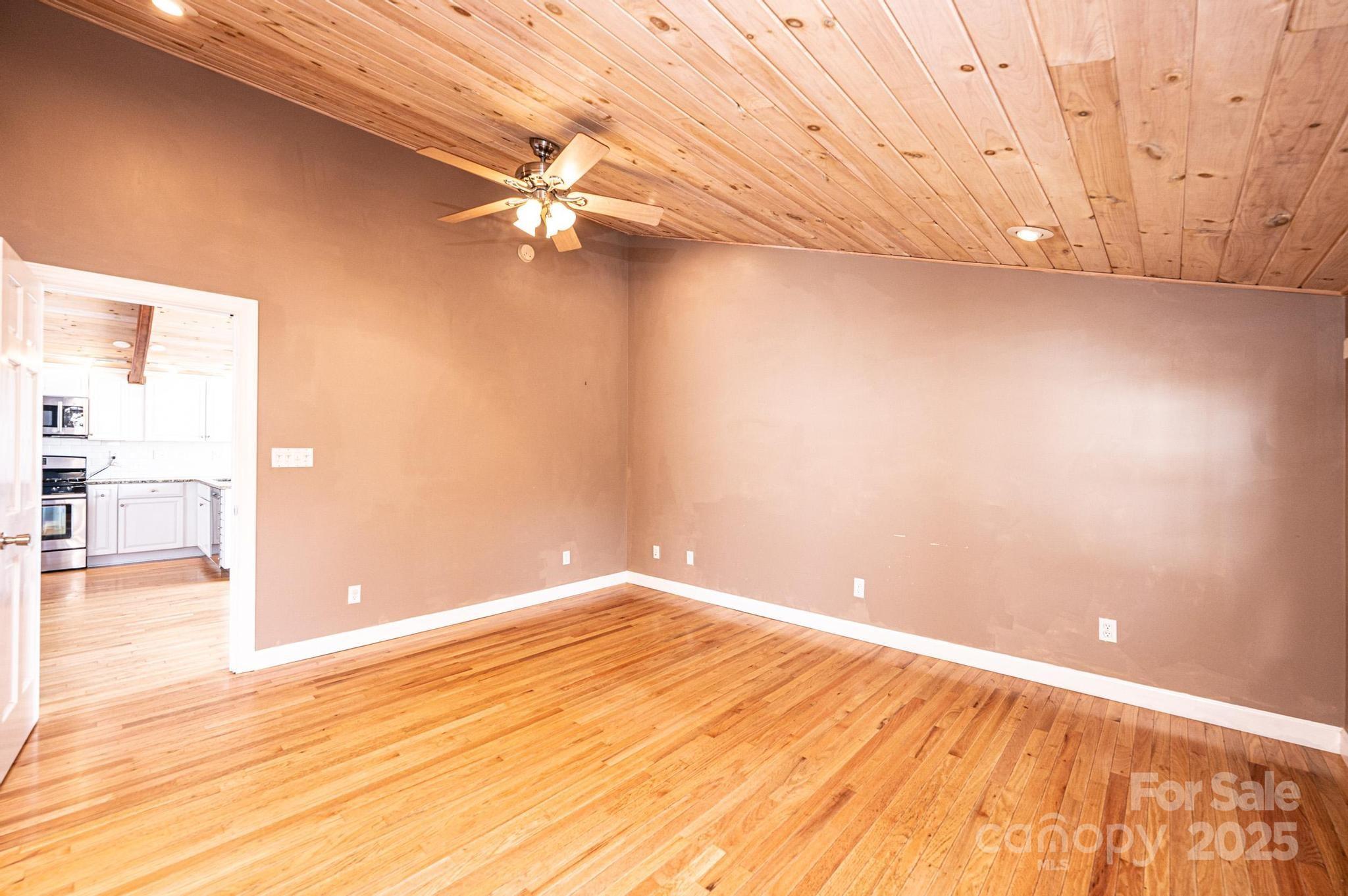 4846 Midway Sand Road Hickory, NC 28601 - Photo 32 of 48 en empty room with wooden floor and windows