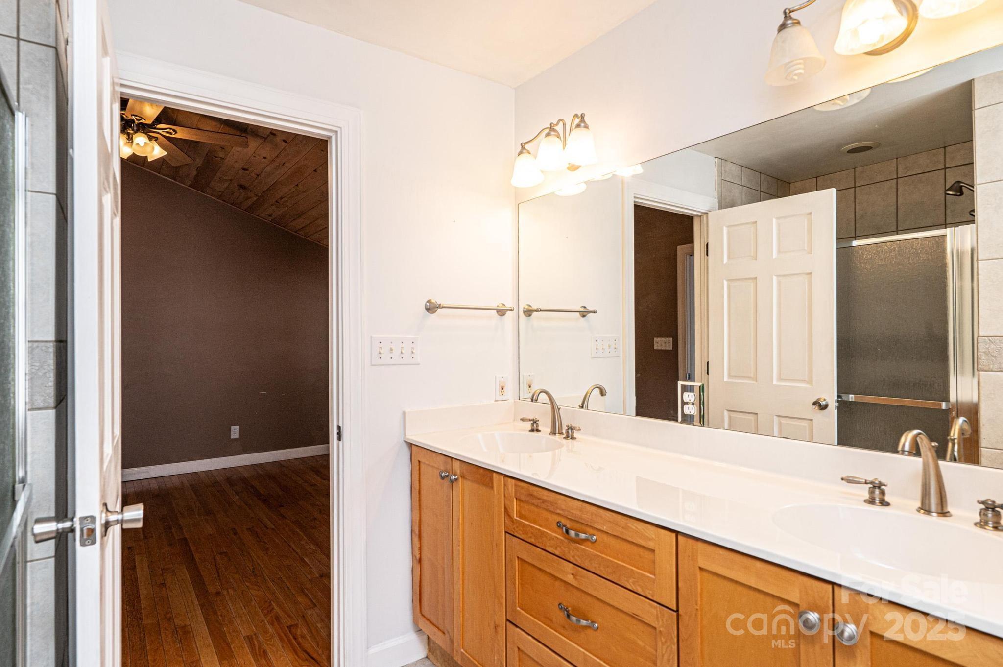 4846 Midway Sand Road Hickory, NC 28601 - Photo 35 of 48 a bathroom with a double vanity sink and mirror