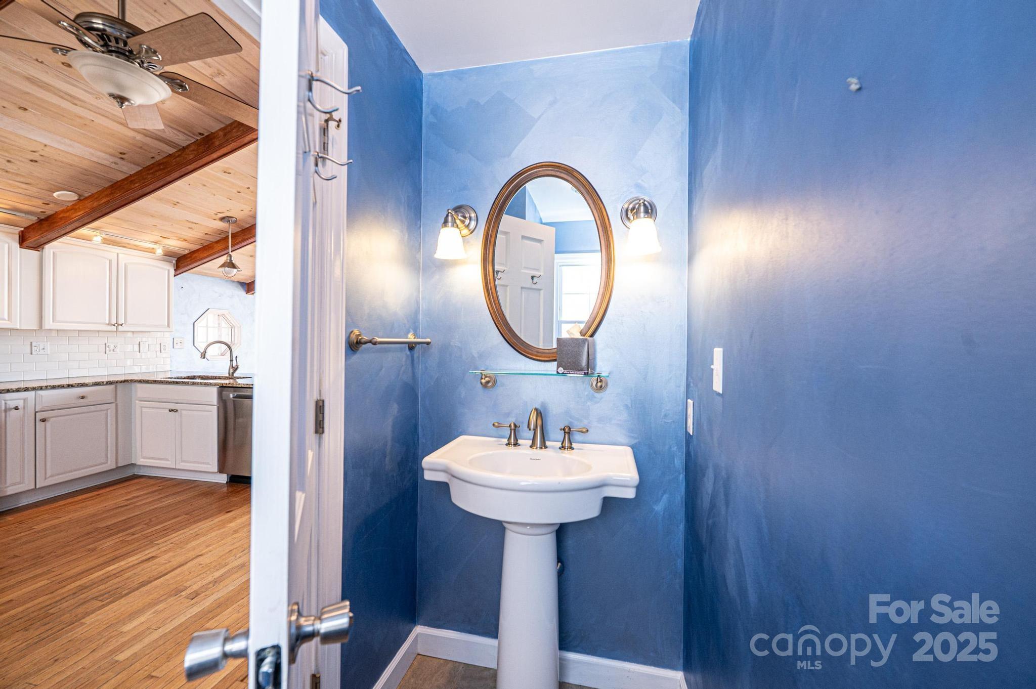 4846 Midway Sand Road Hickory, NC 28601 - Photo 36 of 48 a bathroom with a sink a mirror and a window