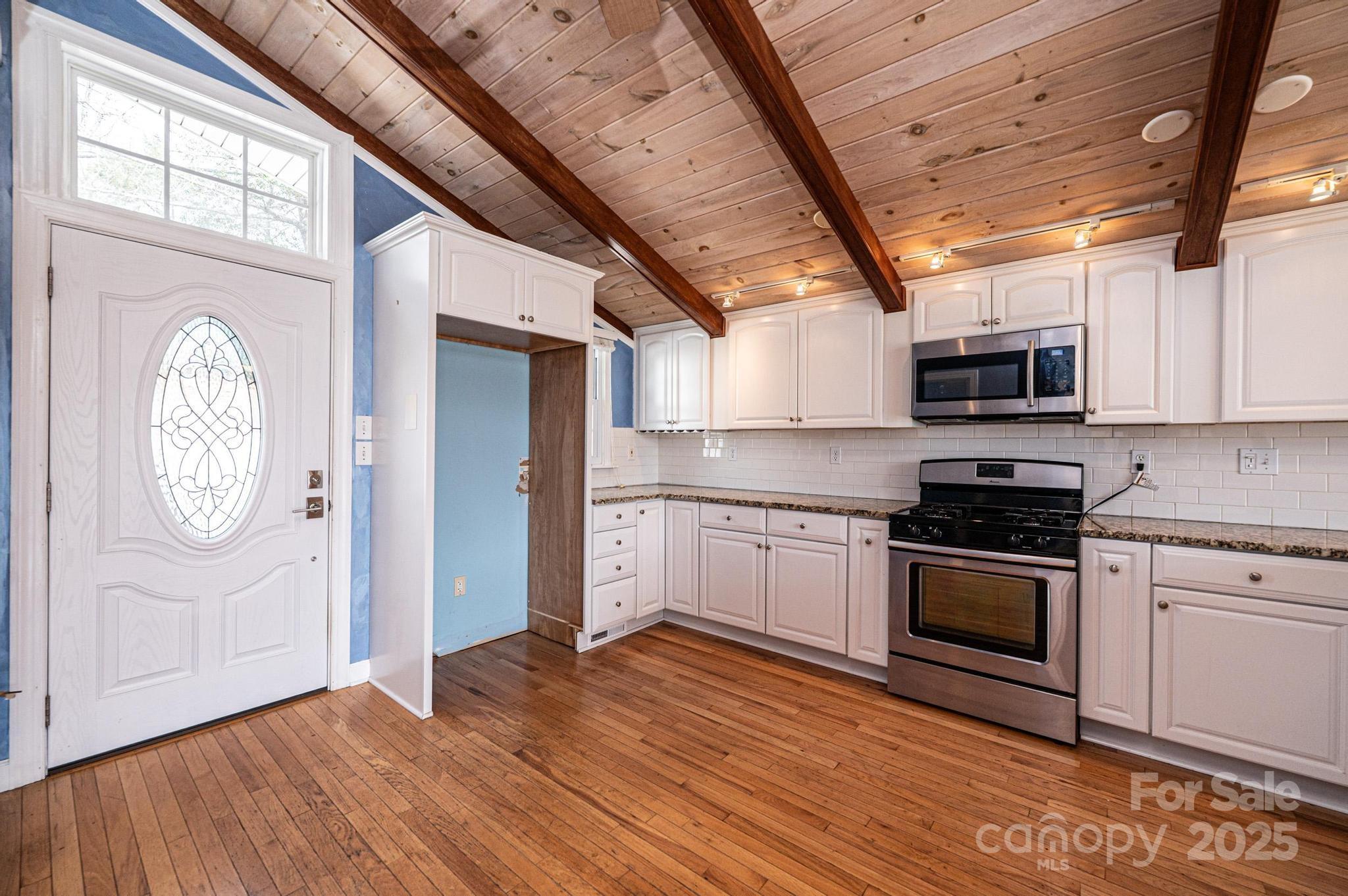 4846 Midway Sand Road Hickory, NC 28601 - Photo 7 of 48 a kitchen with granite countertop a stove and a microwave
