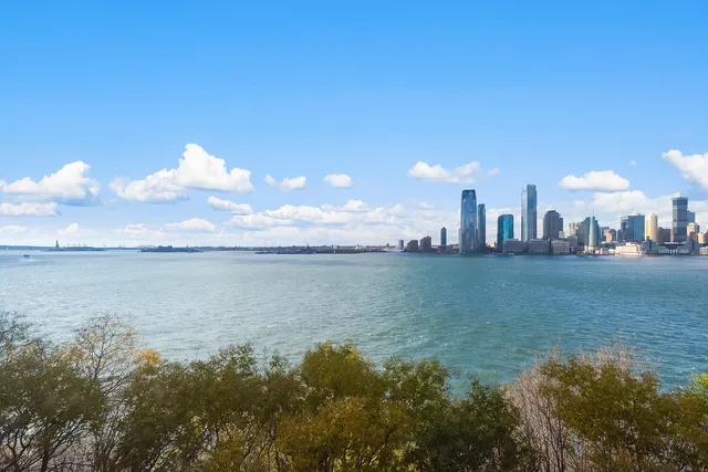 a room with furniture and a floor to ceiling window
