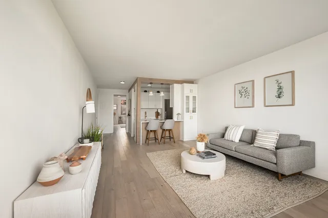 a kitchen with stainless steel appliances granite countertop a sink a stove and refrigerator