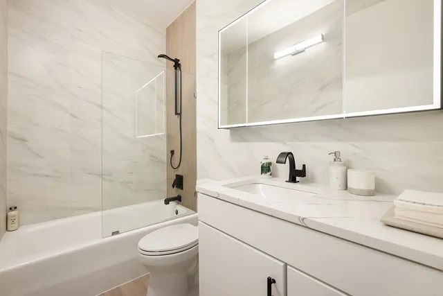 a living room with furniture and white walls