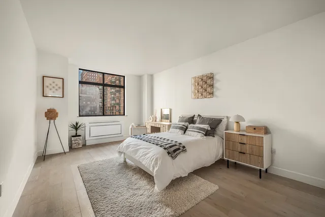 a bathroom with a granite countertop toilet sink and a bathtub