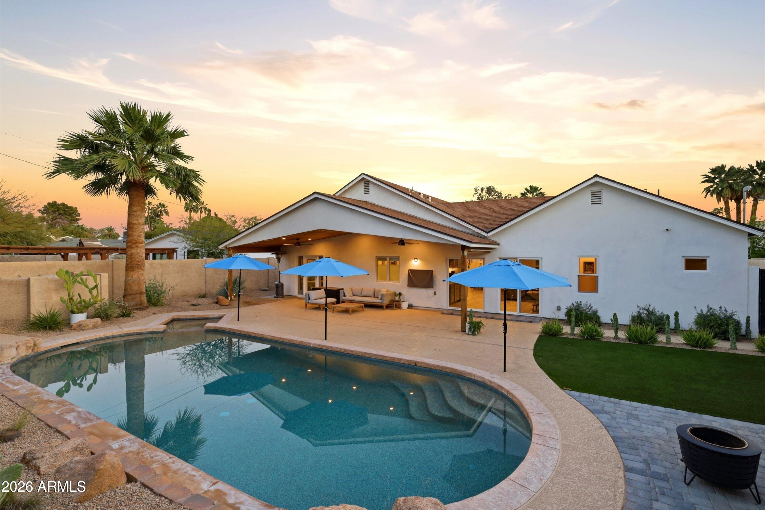 406 West Colter Street Phoenix, AZ 85013 - Photo 2 of 50 a swimming pool with outdoor seating and yard