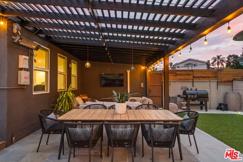a outdoor dining space with furniture and garden