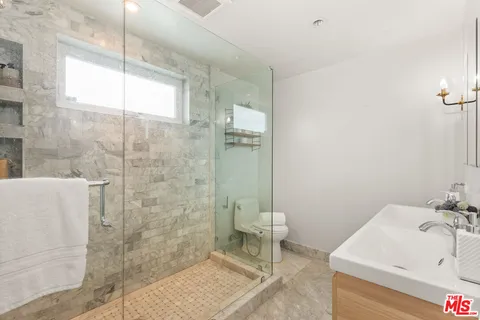 a bathroom with a sink and a shower