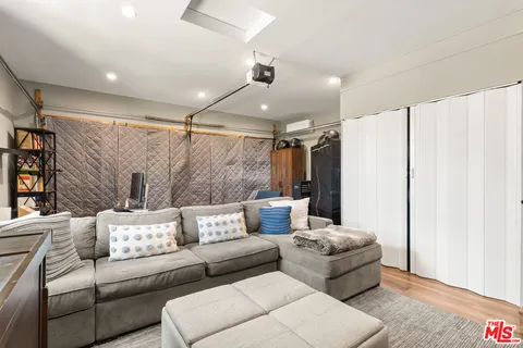 a living room with furniture and a rug