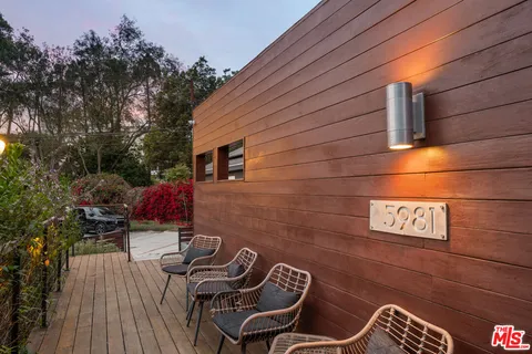 a backyard of a house with seating space