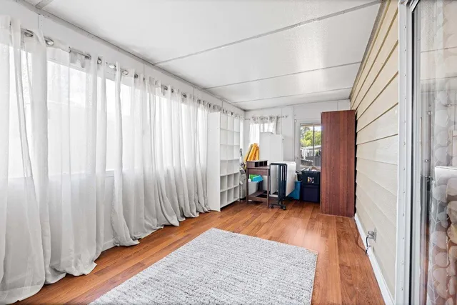 a bed room with a bed and a window