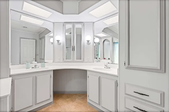 a bathroom with a double vanity sink and a mirror