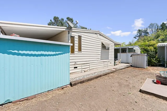 a view of a house with a backyard