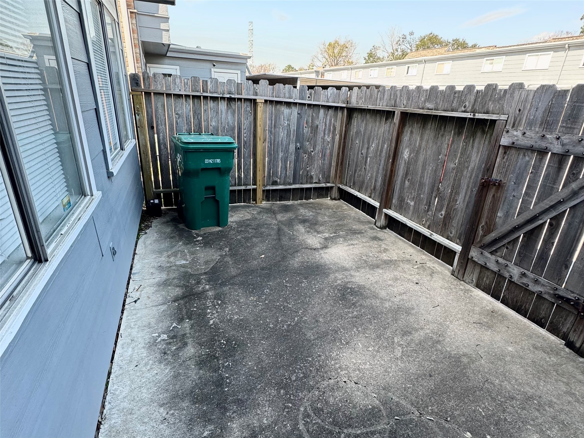 11002 Hammerly Boulevard, Unit 216 Houston, TX 77043 - Photo 15 of 16 Back patio with gate to parking