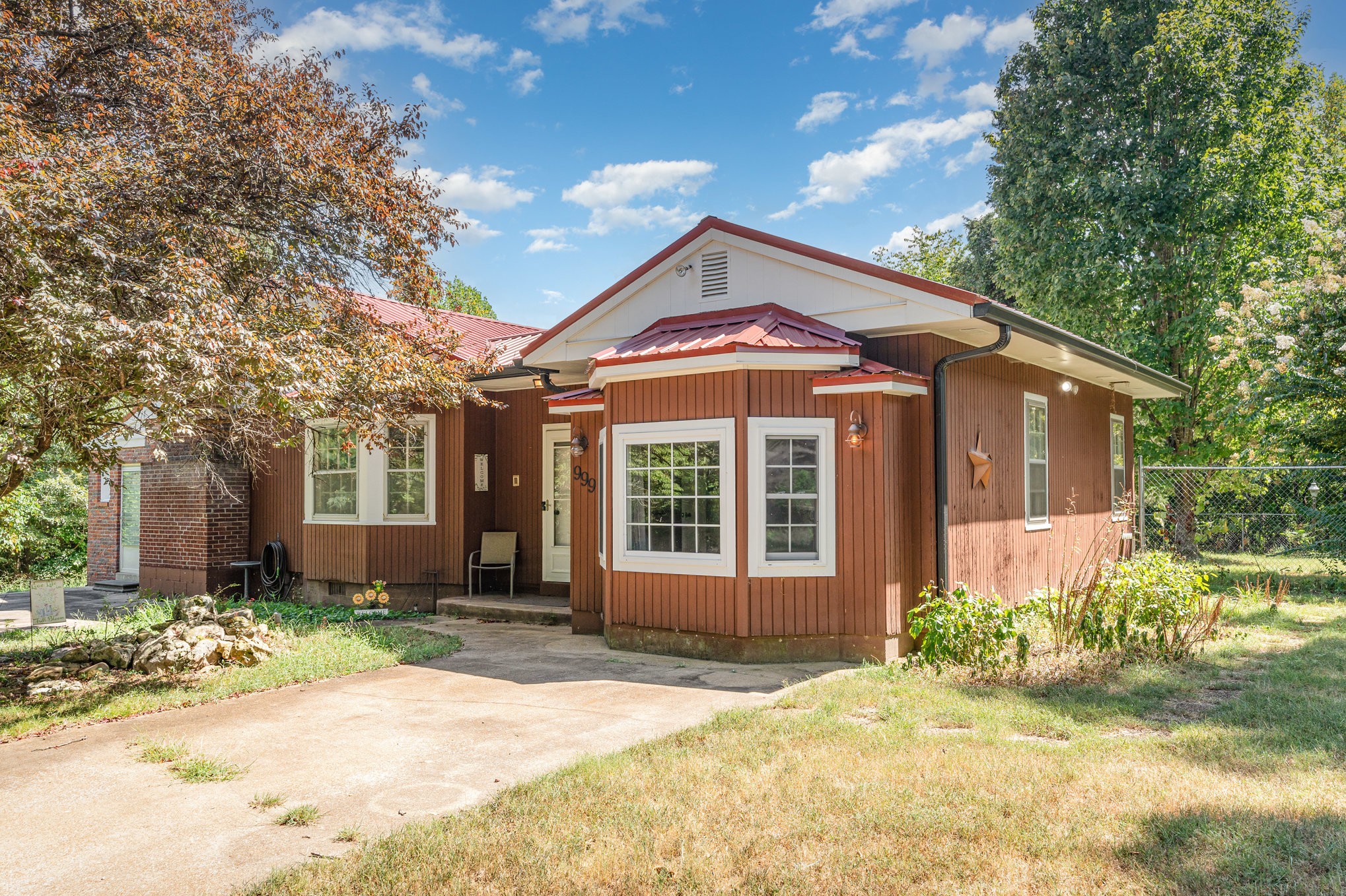 a front view of a house with garden