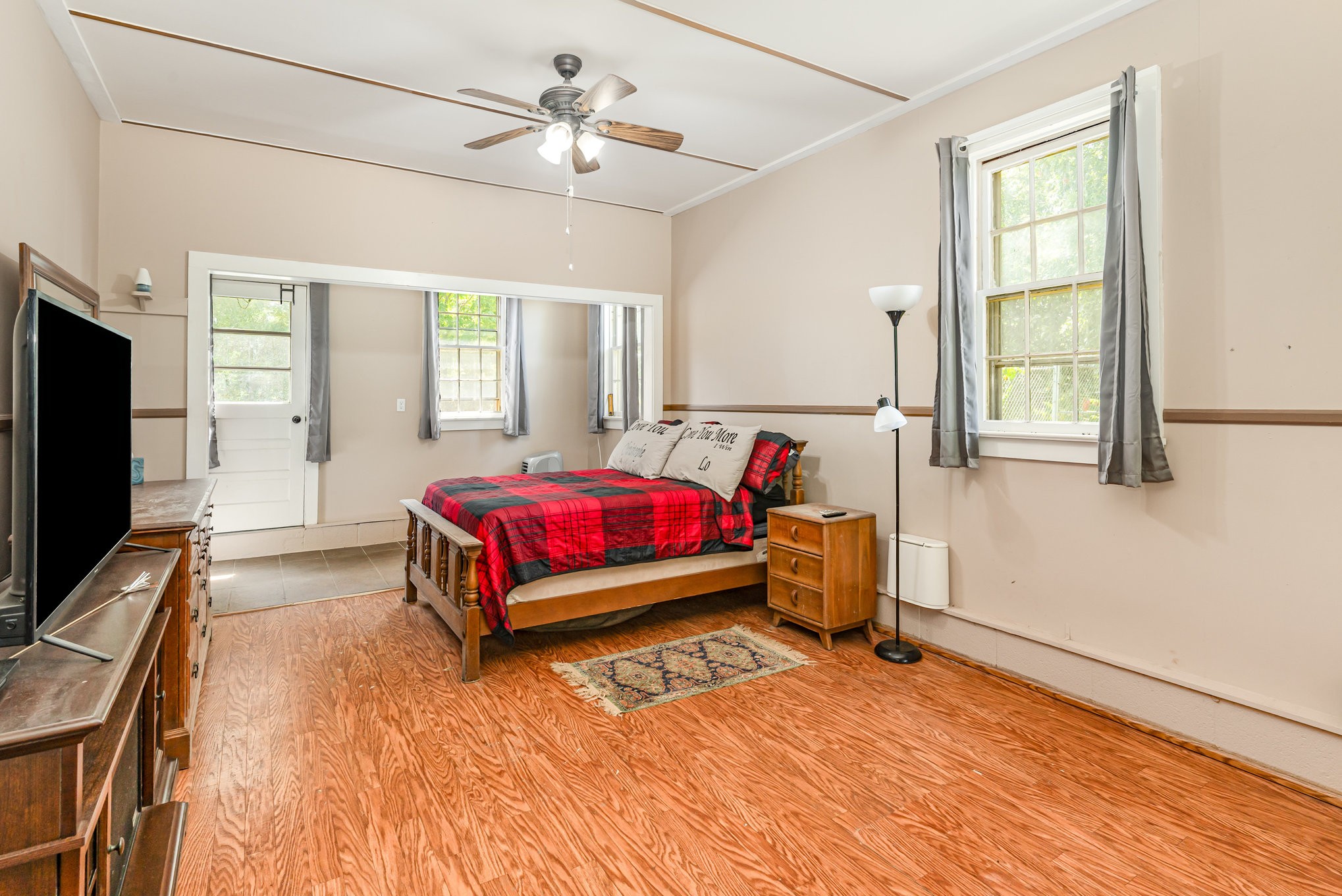 999 Stewart Road Dickson, TN 37055 - Photo 15 of 32 a bedroom with a bed and wooden floor