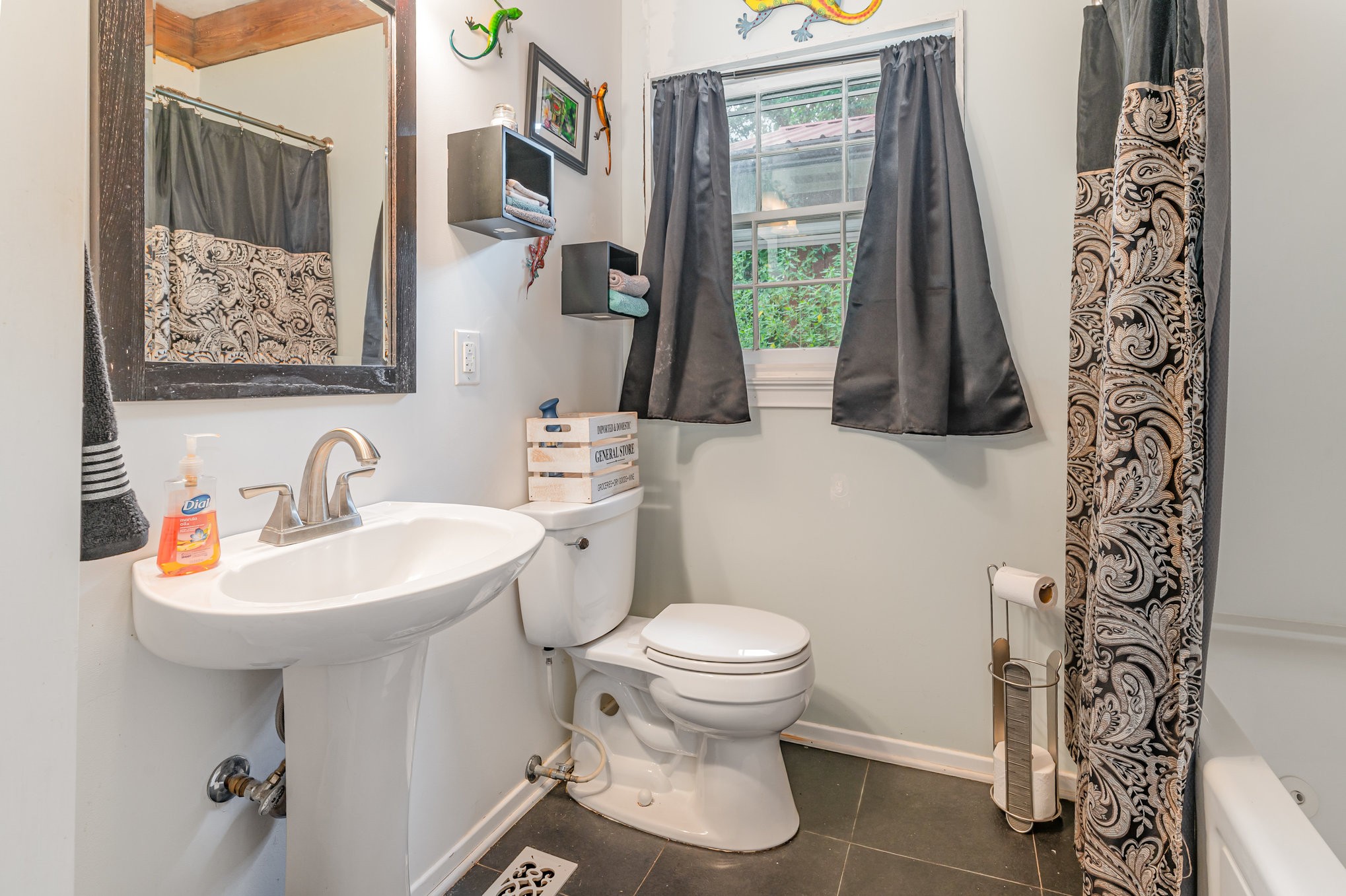 999 Stewart Road Dickson, TN 37055 - Photo 18 of 32 a bathroom with a toilet sink and mirror