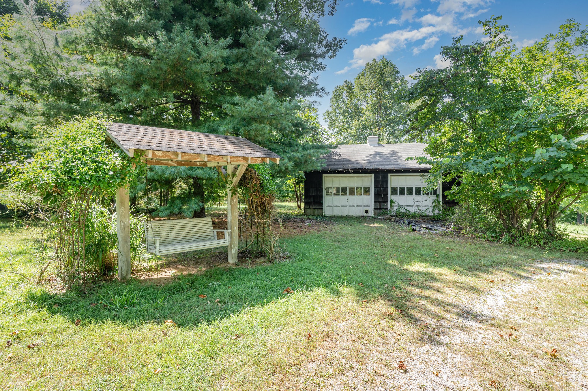 999 Stewart Road Dickson, TN 37055 - Photo 29 of 32 a front view of a house with a yard table and chairs