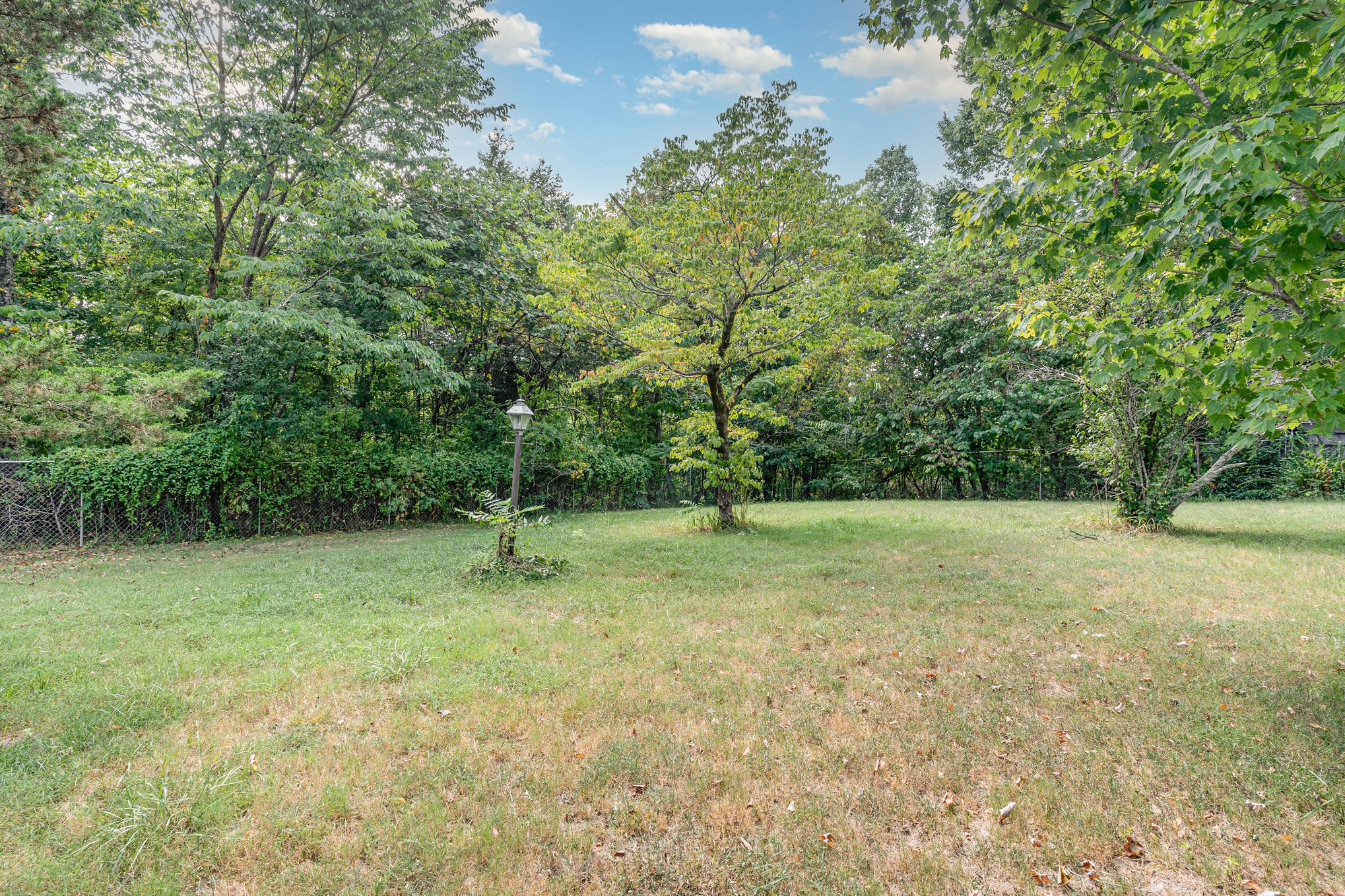 999 Stewart Road Dickson, TN 37055 - Photo 31 of 32 a view of outdoor space with deck and yard