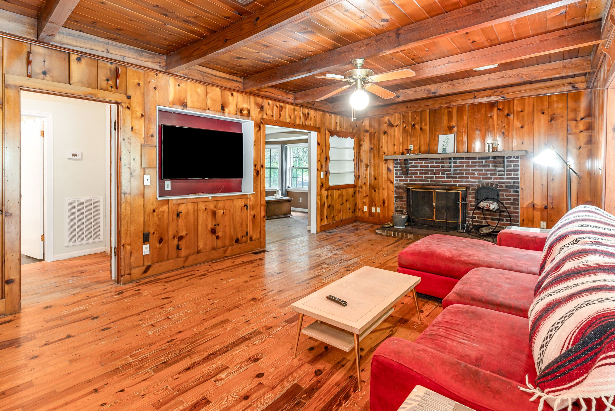 999 Stewart Road Dickson, TN 37055 - Photo 9 of 32 a living room with furniture a flat screen tv and a fireplace