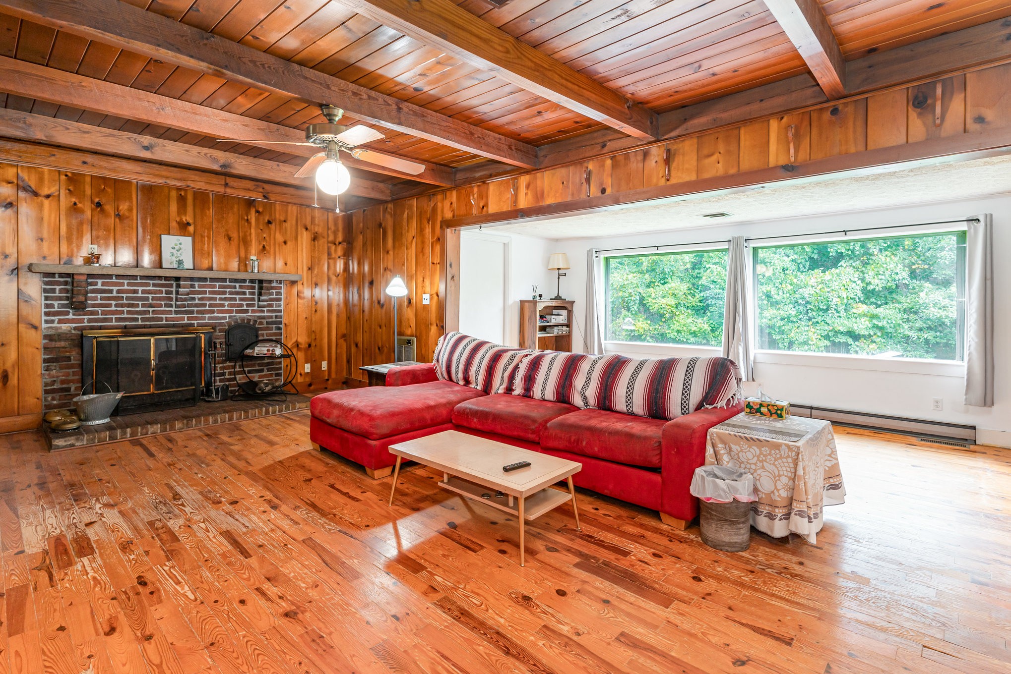 999 Stewart Road Dickson, TN 37055 - Photo 10 of 32 a living room with furniture a fireplace and wooden floor