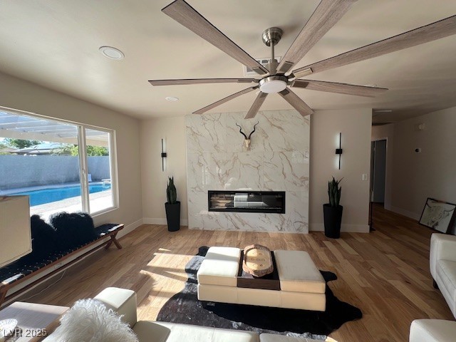 2712 Rialto Road Las Vegas, NV 89108 - Photo 1 of 54 Living area with wood finished floors, ceiling fan, a fireplace, and recessed lighting