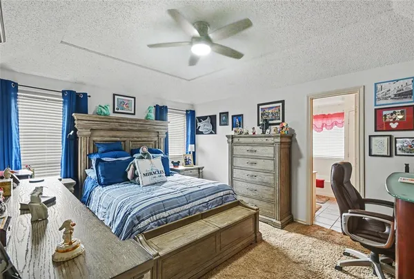 a bedroom with a bed and furniture