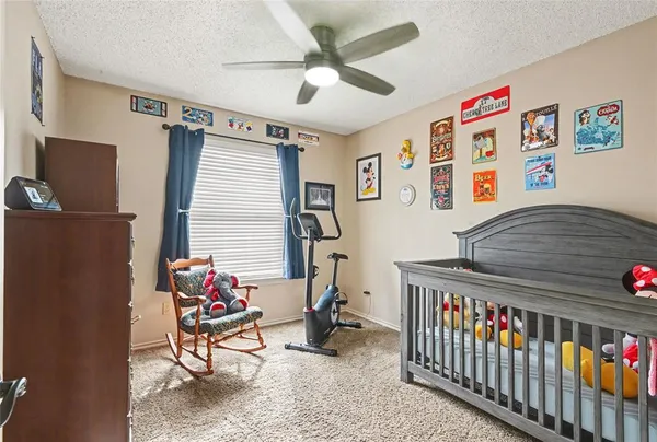 a bedroom with furniture a rug and a window