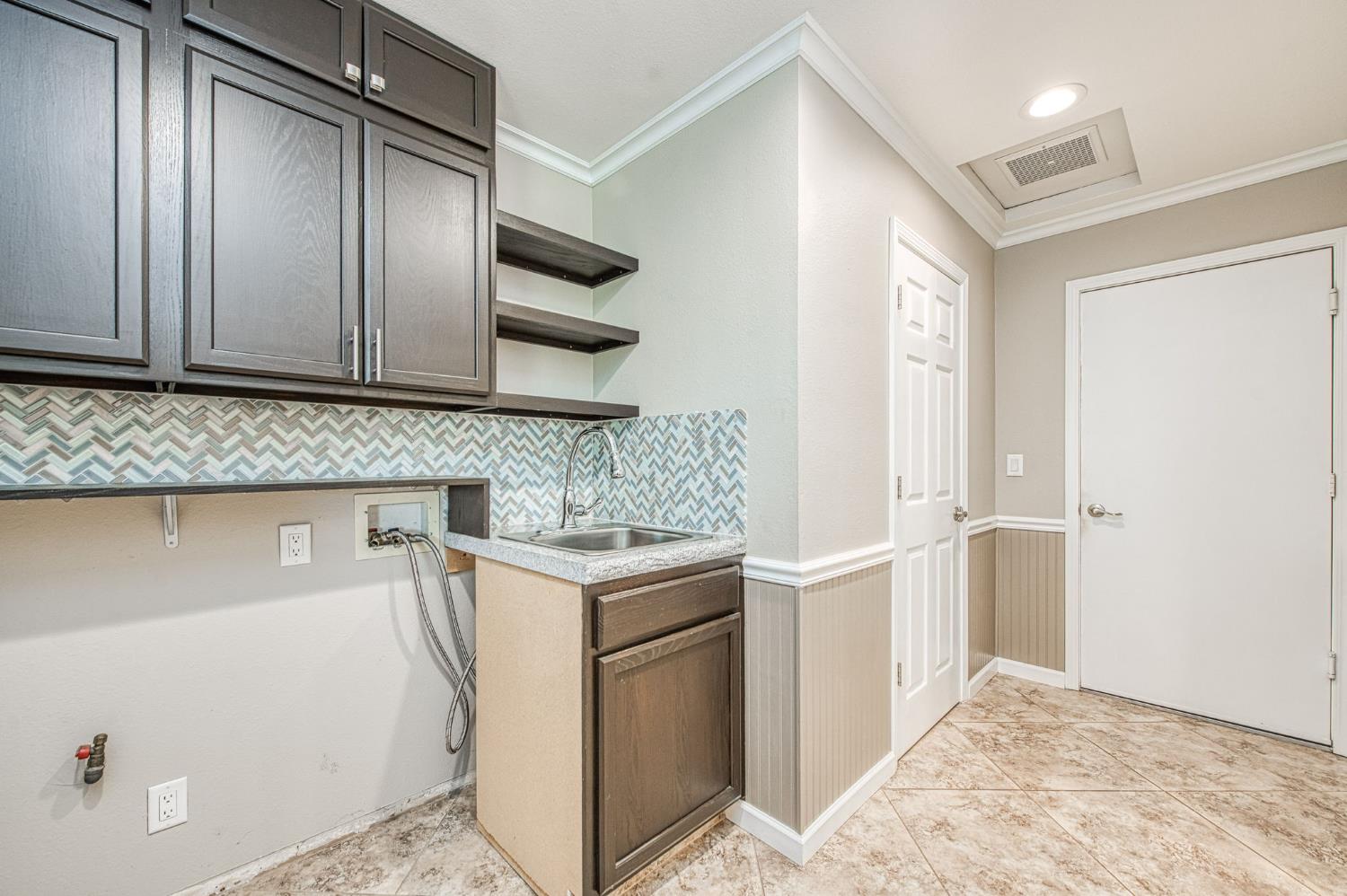 33717 River Knolls Road Coarsegold, CA 93614 - Photo 25 of 66 a kitchen with a cabinets and refrigerator
