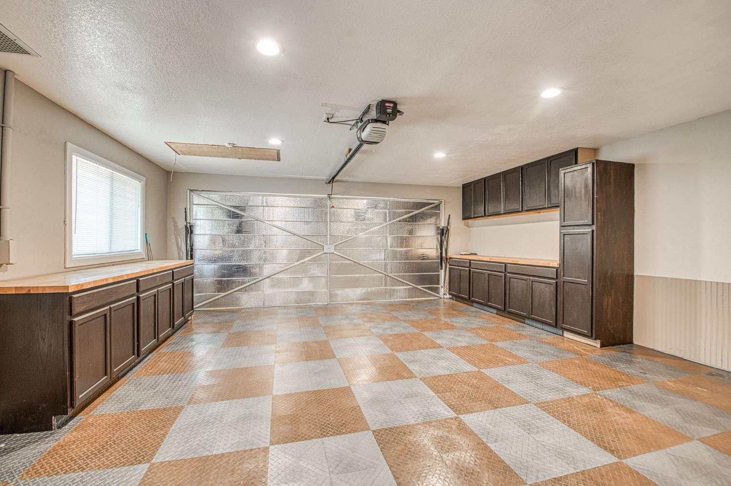 33717 River Knolls Road Coarsegold, CA 93614 - Photo 26 of 66 a bathroom with granite countertop a glass door shower and a yard