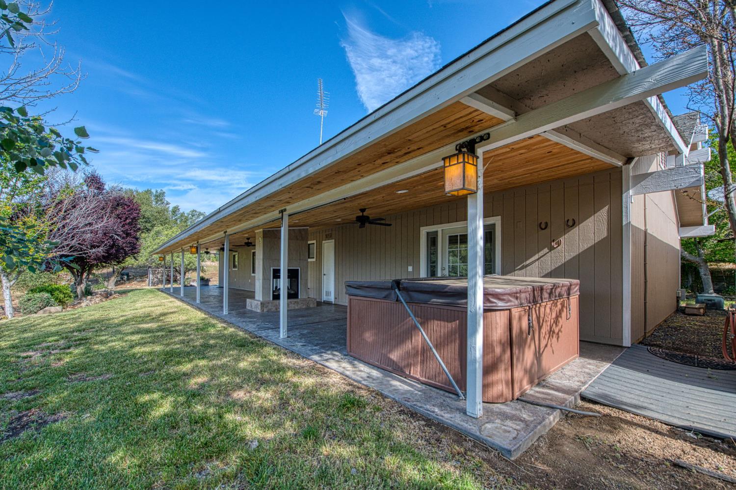 33717 River Knolls Road Coarsegold, CA 93614 - Photo 32 of 66 a view of house with backyard porch and furniture