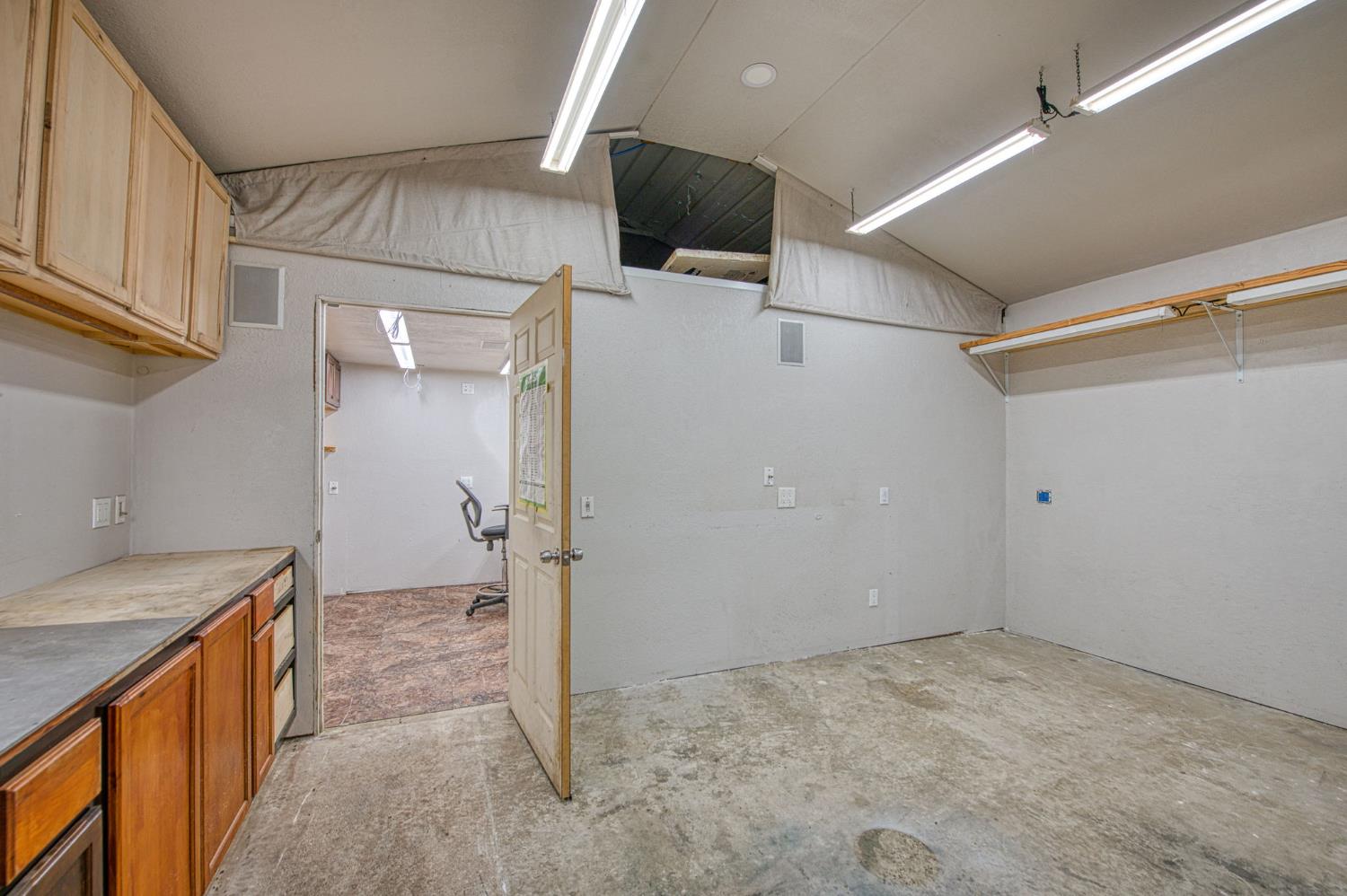 33717 River Knolls Road Coarsegold, CA 93614 - Photo 34 of 66 a view of a storage & utility room with a sink