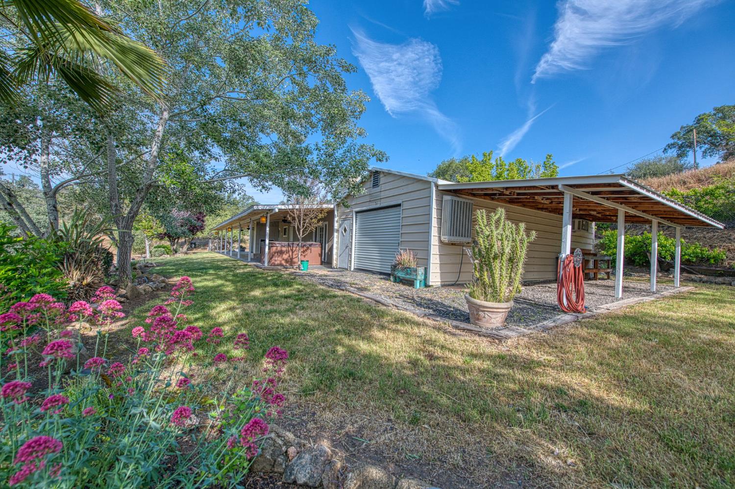 33717 River Knolls Road Coarsegold, CA 93614 - Photo 36 of 66 a view of a house with backyard and porch