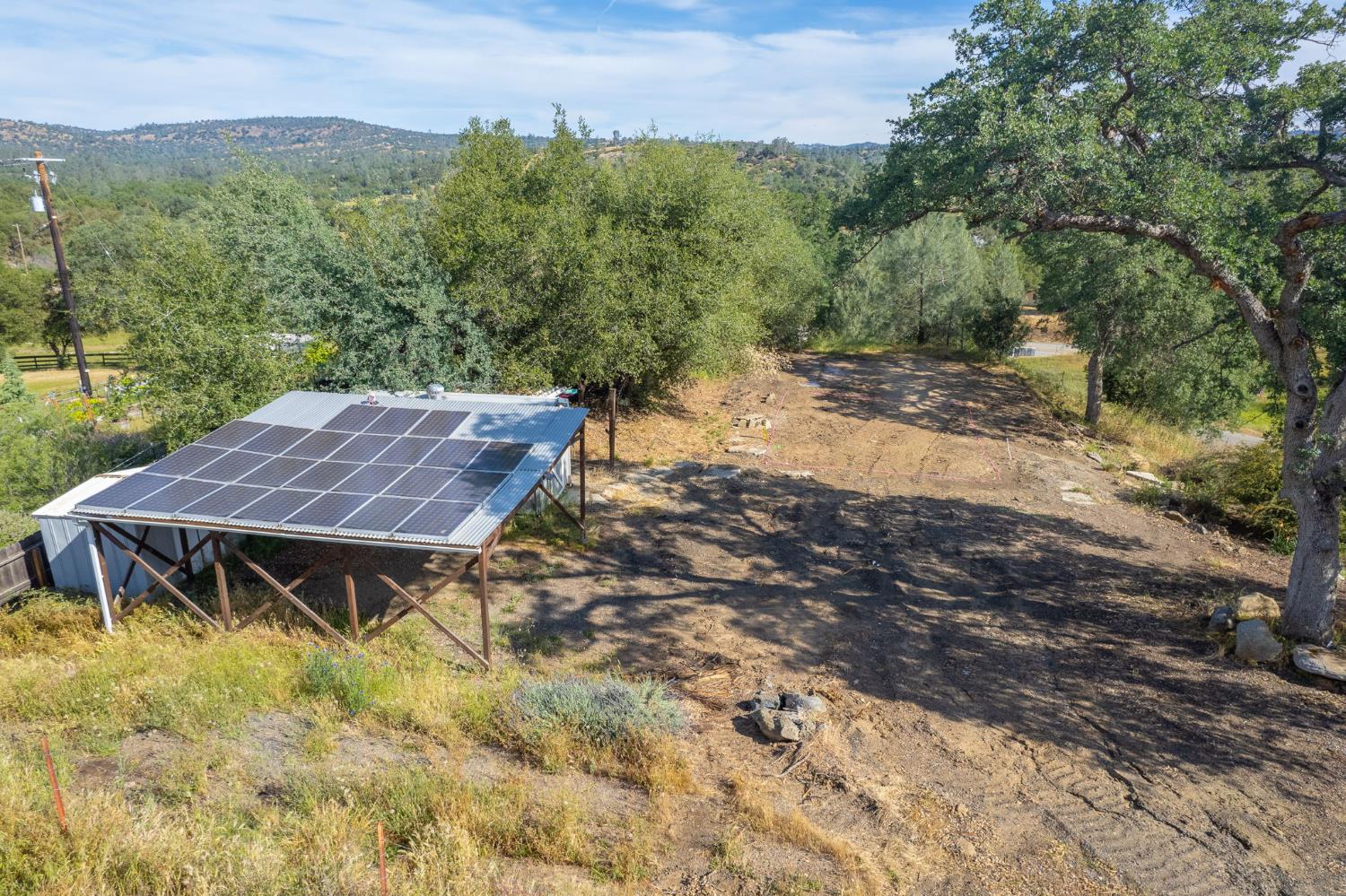 33717 River Knolls Road Coarsegold, CA 93614 - Photo 49 of 66 a view of house with yard and trees in the background